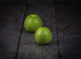 abstract, dark, green apple, black wooden table