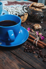 The cup of coffee, coffee beans and cookies-hearts related toget