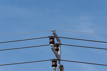 Electrical wiring and Electrical insulators on power pole.