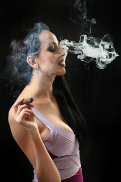 Girl Smoking a cigar .