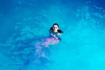 pretty sexy woman in swimming pool