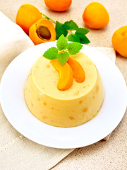 Panna cotta apricot with fruit on table