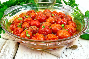 Tomatoes baked in glass pan on light board