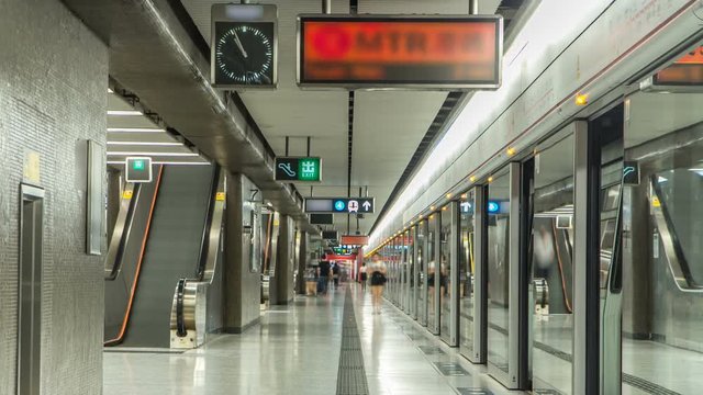 Subway train station interior timelapse in Central, Hong Kong. MTR is the most popular transport in Hong Kong
