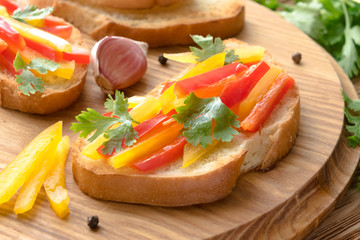 Fresh and tasty bruschetta with color pepper, coriander