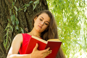 woman reading a book on the street