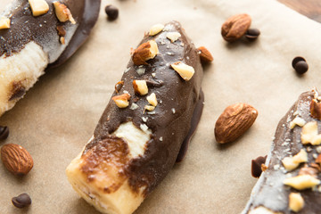 Fresh banana with chocolate and nuts