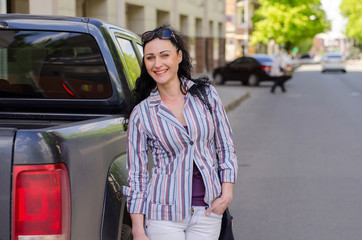 Obraz premium girl stand by the car