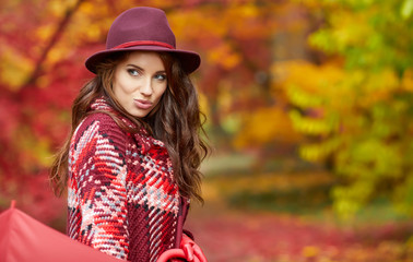 Young woman in autumn park