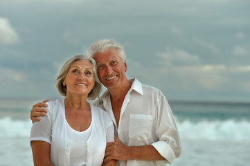 Fototapeta na wymiar elderly couple rest at tropical beach