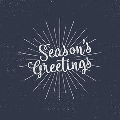 Merry Christmas lettering. Season's greetings. Holiday typography vector. Letters composition with sun bursts and halftone texture. Use as photo overlay, place to cards, print on t shirt, tee design