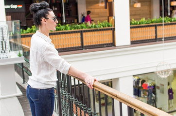 Young woman standing in the shopping mall