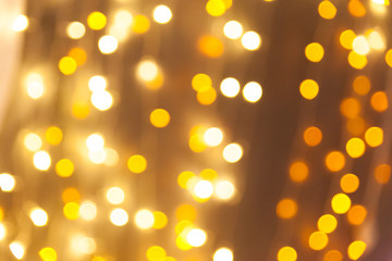 Obraz premium Christmas background with golden bokeh lights