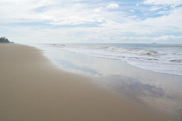 Tropical beach of thailand with incoming wave.