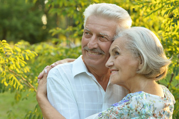 Mature couple on  walk  in summer