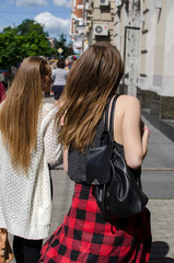 Two girlfriends are walking 