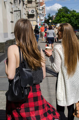 Fototapeta premium Two girlfriends are walking 