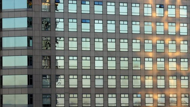 Zoom Out of Modern Office Building Windows