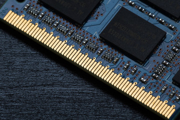 Computer memory chip on a dark wooden background