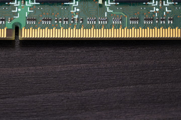 Computer memory chip on a dark wooden background
