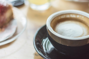 Soft focus on latte coffee cup, coffee for background - vintage