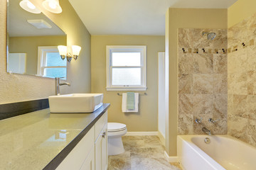 Fototapeta na wymiar Clean and warm bathroom interior with marble tile