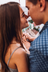 Young couple exploring an old town. Man pointing at some landmark. Man and woman  with baloonsvisiting city and enjoying view. building city administration currently open view point for tourists. 