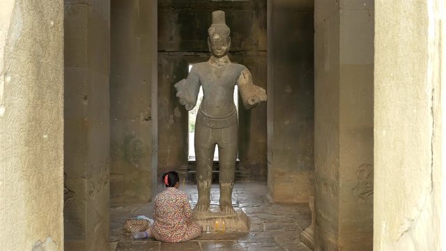 Women Praying to Statue of Buddha God - Angkor Wat Temple