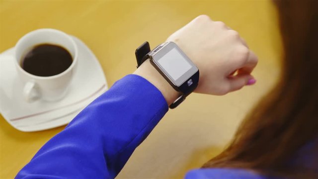 Coffee break with person using smartwatch on wrist 4K
