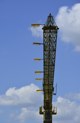 Fototapeta na wymiar Crane from below with blue sky background