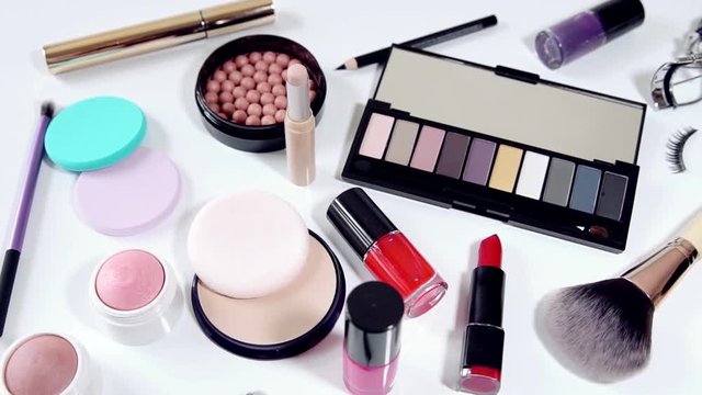 collection of makeup cosmetics on white background
