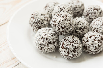 Unsweetened coconut energy bites with cocoa