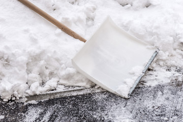 snow shovel standing in the snow