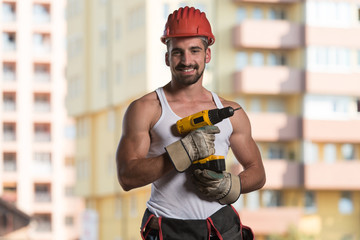 Portrait Of A Worker With Drill