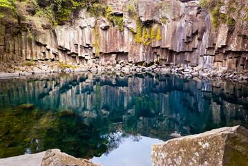 pond of famous Cheonjiyeon Falls on Jeju Island of South Korea