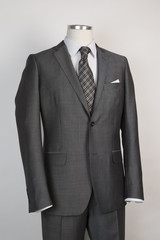 taylored menswear suit. On a mannequin. grey fabric