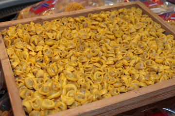 Uncooked Tortellini Italian Pasta in Wooden Box