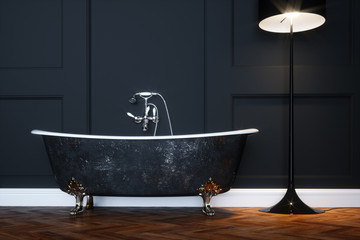 Vintage black bathtub with silver legs in antique interior