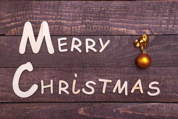 Christmas collection, gifts box, tree and decorative ball, on wood background.