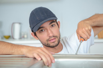 Man fitting kitchen sink