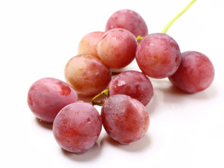 Red rose grapes bunch isolated on white background