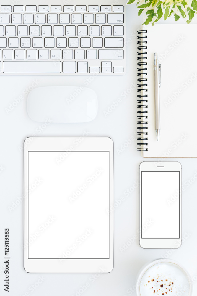 Aufkleber phone and tablet blank screen on white table format vertical top
