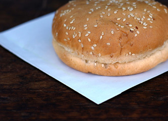Bread for burger or sandwich on white paper with copyspace place