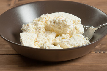 Homemade Cottage Cheese In Bowl. Soft Cheese.