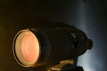 closeup macro of camera lense with reflections low key image telephoto