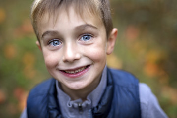 Portrait of a five year old boy in autumn season