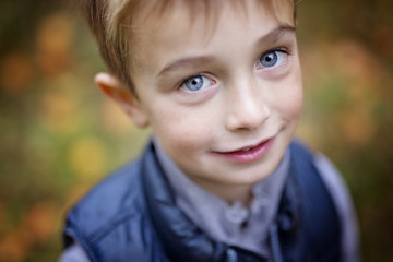 Portrait of a five year old boy in autumn season