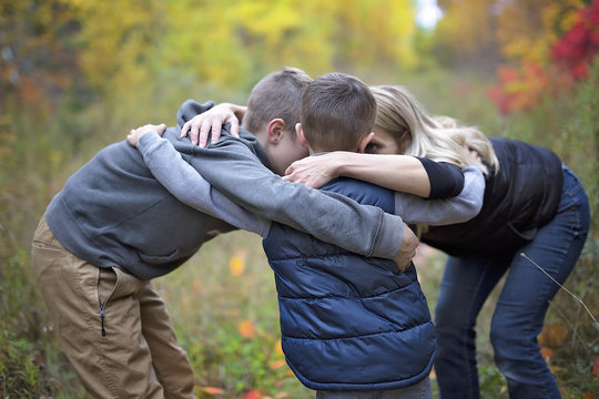 Mother with two child in autumn season