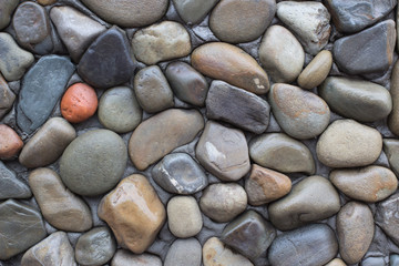 wall of different cobblestone. diversity of stones