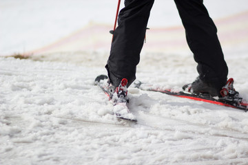 legs of skier on a loose snow hills